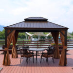 Varikatus SUNSET 3,65×4,85xH2/2,7m, pruun/beež Varikatused ja aiatelgid Varikatused ja aiatelgid